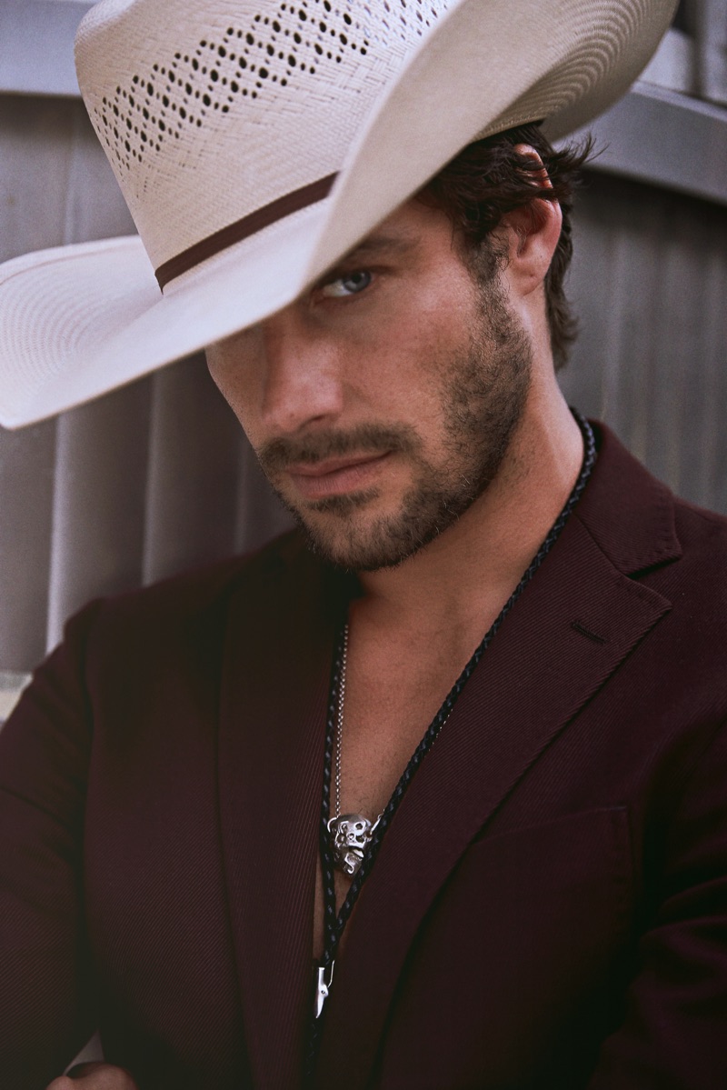 Gonçalo wears suit jacket BOSS, hat Space Cowboy, and bolo tie Britt Bolton Jewelry. 