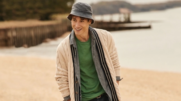 Now & Later: Nicolas Ripoll Tackles Transitional Style from J.Crew All smiles, Nicolas Ripoll wears a J.Crew cable-knit cardigan $125, chambray shirt $79.50, t-shirt $19.50, 10.5" chino shorts $65, and a bucket hat $39.50.