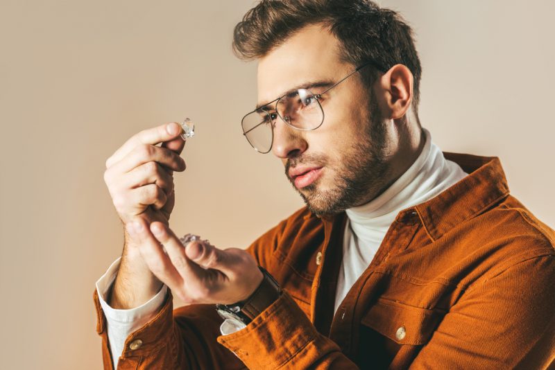 Man Looking at Diamond