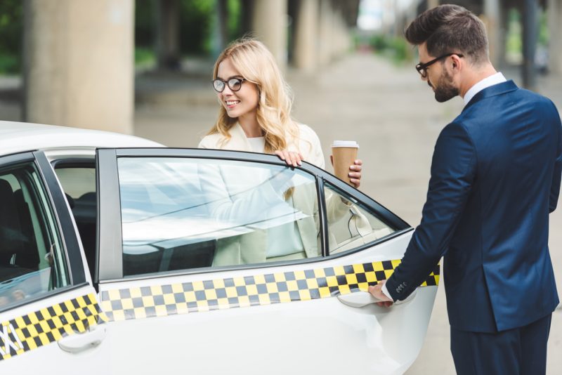 Man Opening Door for Woman Man Opening Door for Woman