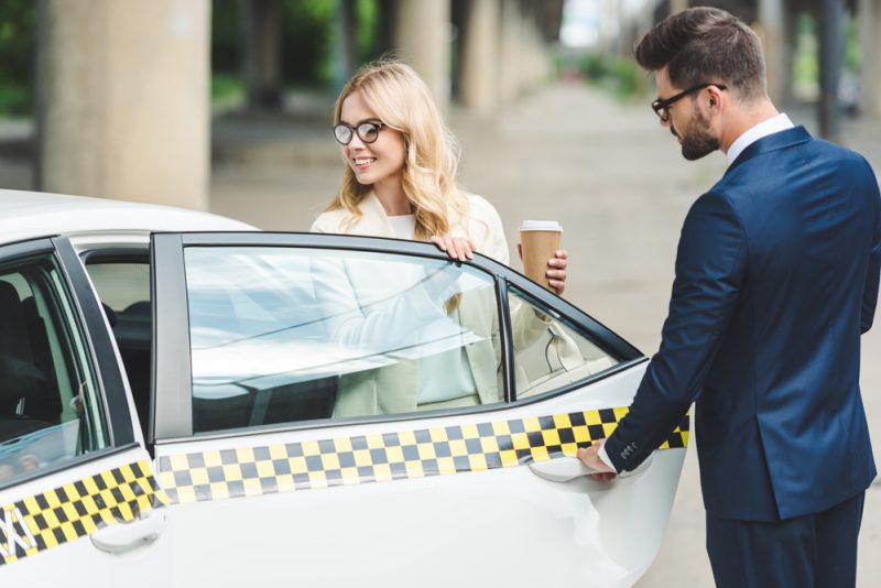 Man Opening Door for Woman