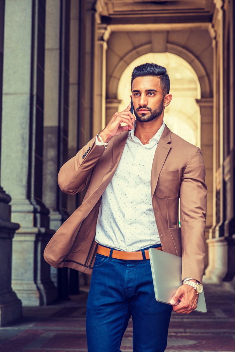 Man Unlined Blazer Jeans Talking on Phone