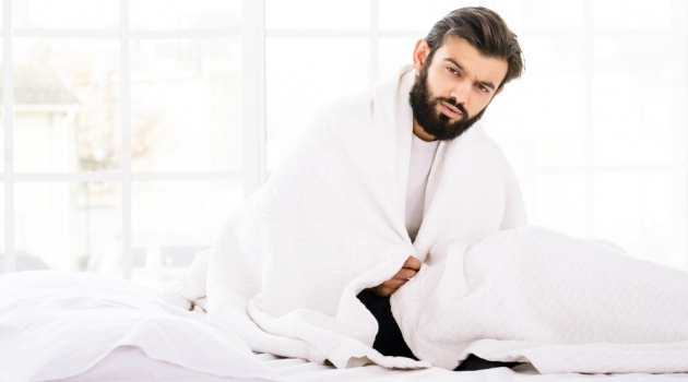 How to Choose a Mattress with the Perfect Bed Frame for a Compact Base? Man in Bed White Down Comforter Mattress