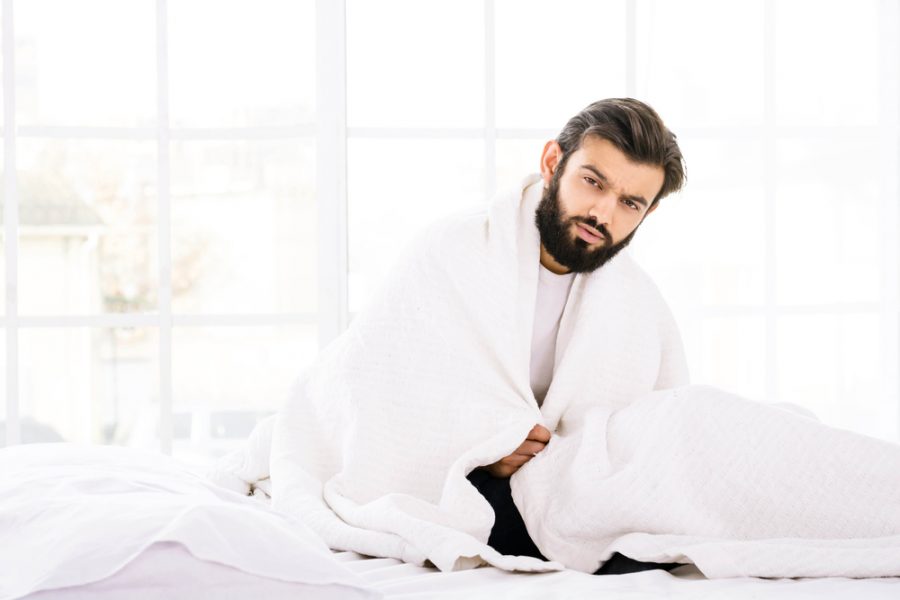 Man in Bed White Down Comforter Mattress