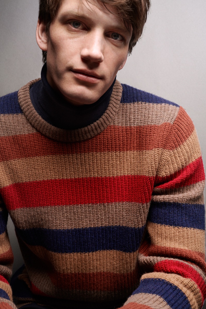 Front and center, Florian Van Bael models a striped Marc O'Polo sweater.