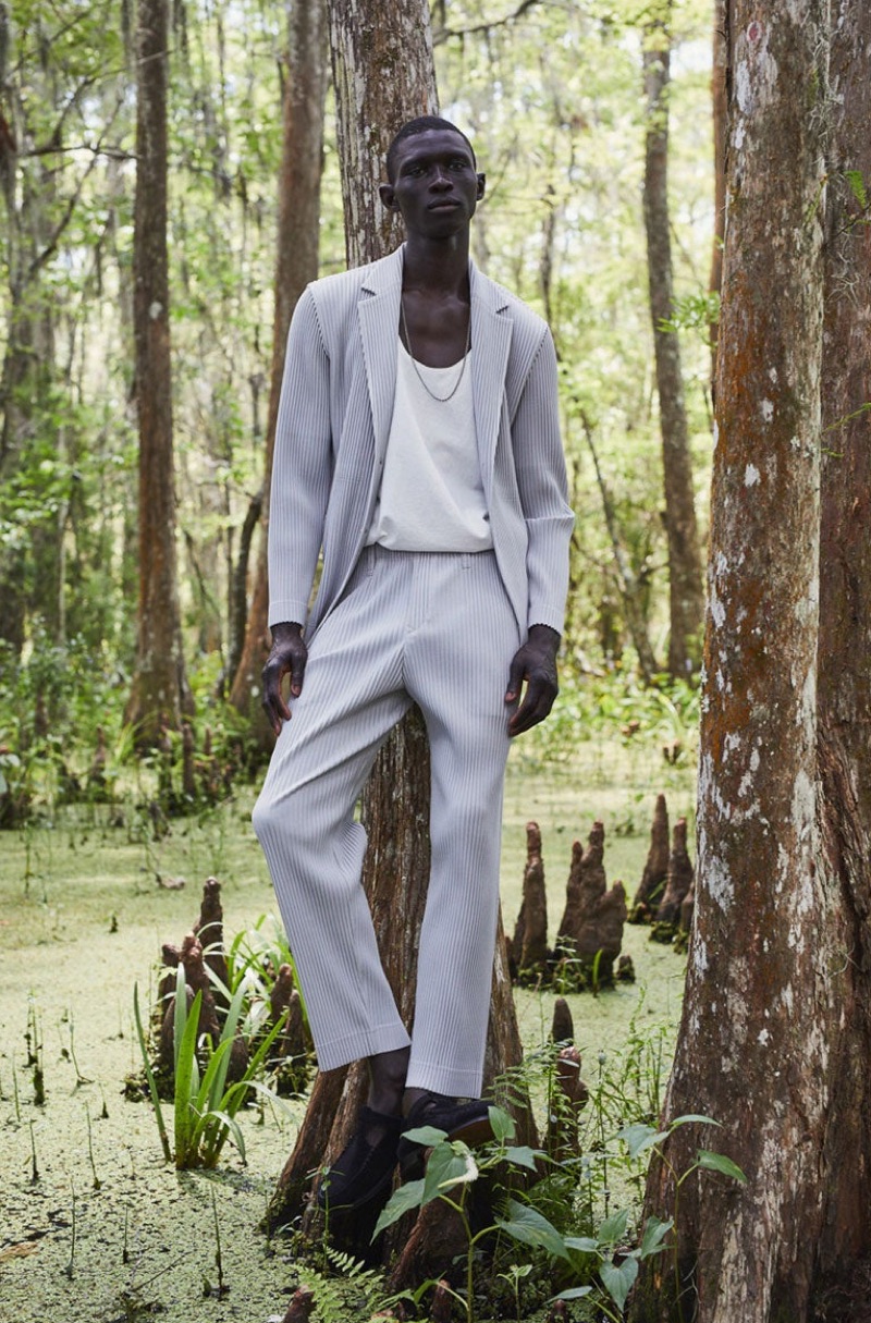 Fernando Cabral dons a suit by Homme Plissé Issey Miyake with a Bottega Veneta tank and Hereu shoes.