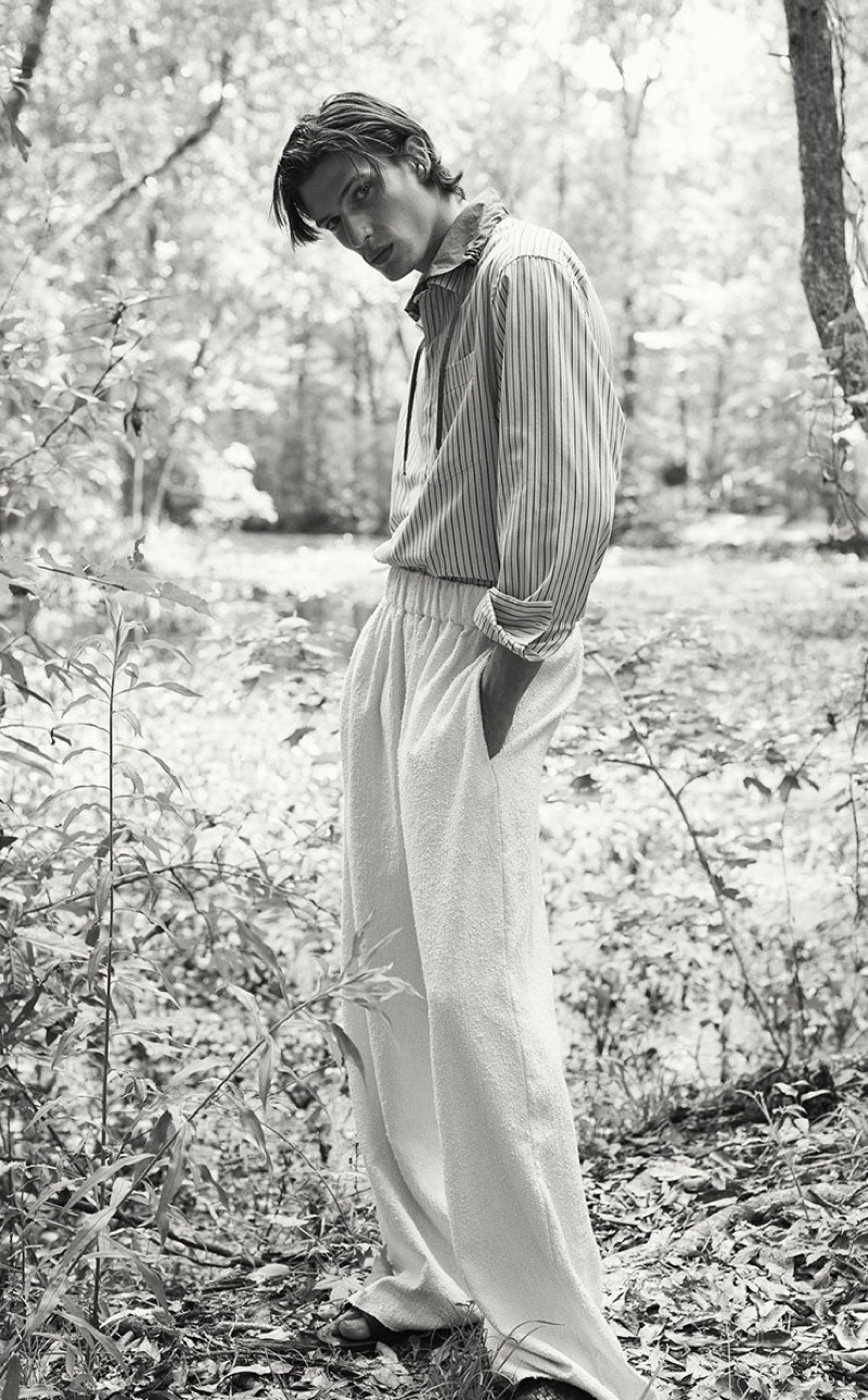 Donning neutrals, Edoardo Sebastianelli models a Lanvin shirt with Marrakshi Life trousers, and Bottega Veneta slides.