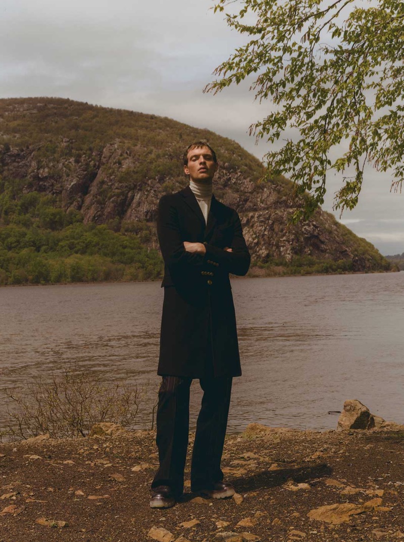 Taking to the outdoors, Rocky Harwood dons a Givenchy coat and Rick Owens boots with a sweater and trousers by Lanvin.