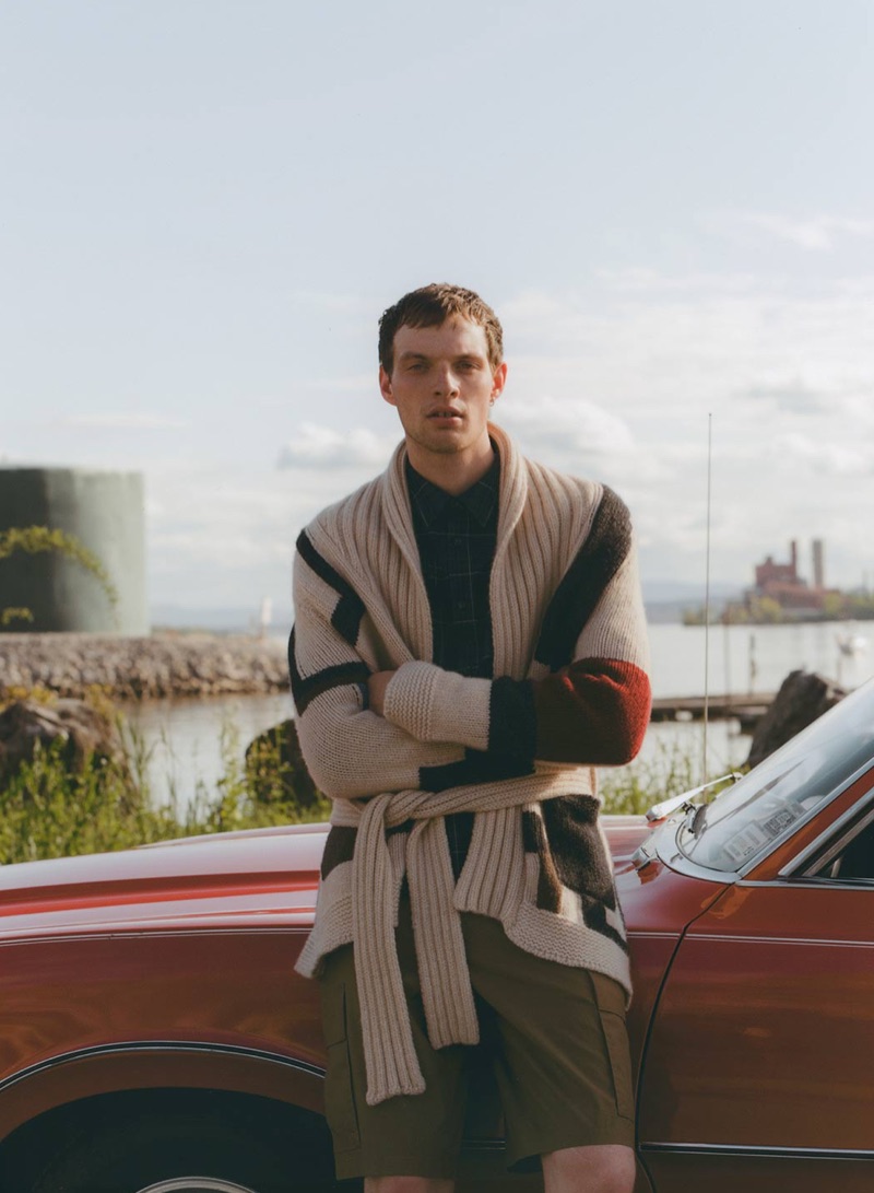 Ready for the new season, Rocky Harwood models a Connolly cardigan, A.P.C. shirt, and Helmut Lang shorts.