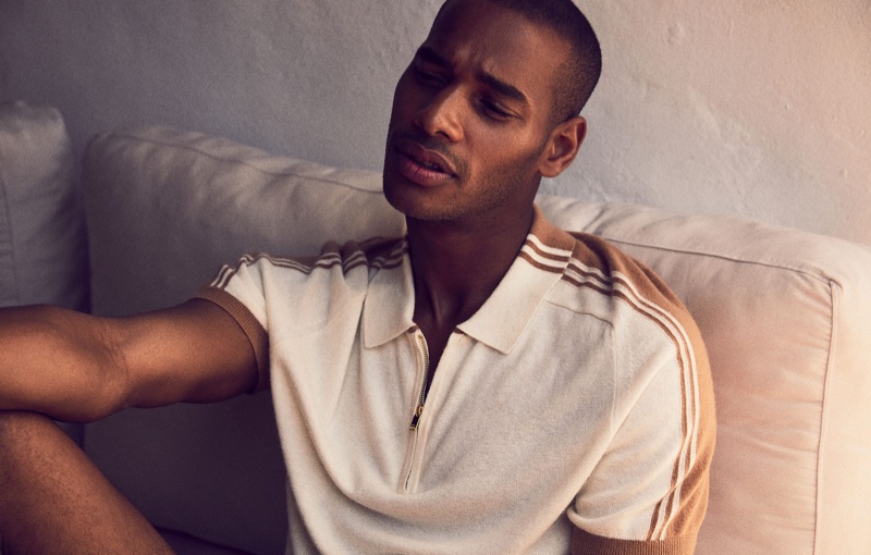 Stealing a relaxed moment, Sacha M'Baye wears Reiss.