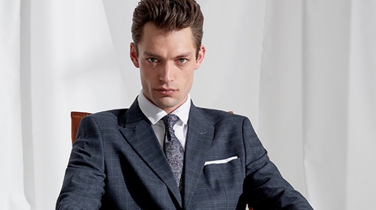 Model Nick Rae dons an elegant suit from Selected Homme.