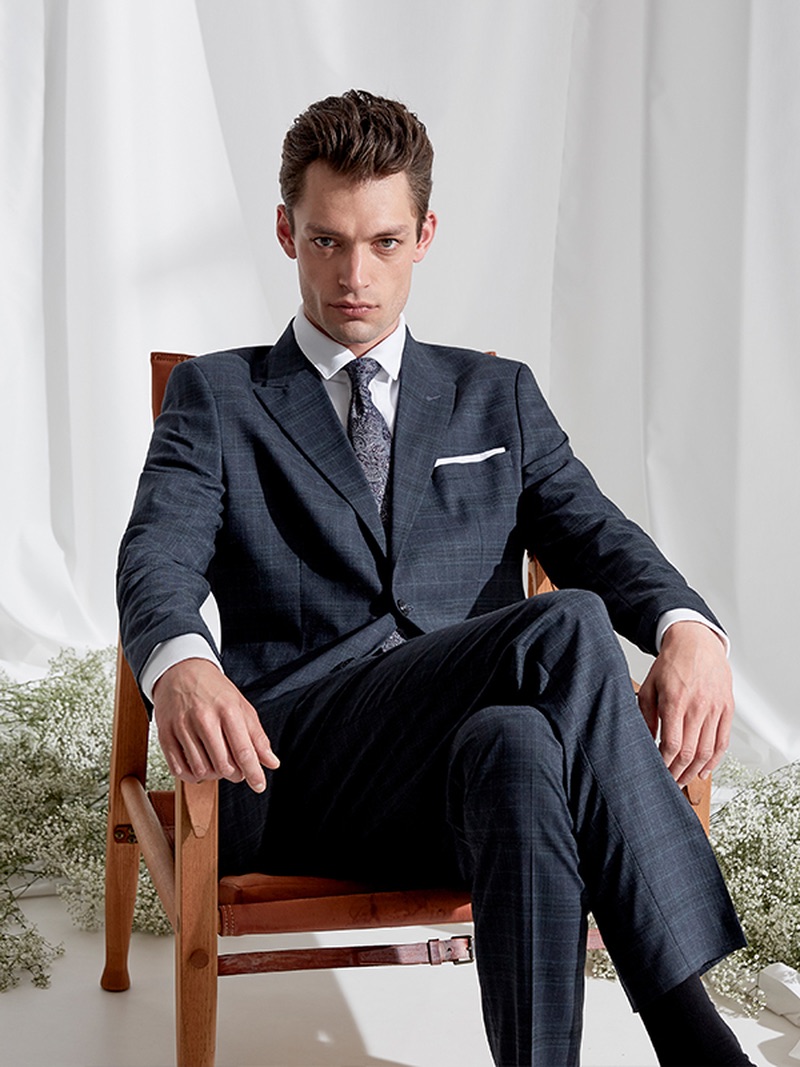 Model Nick Rae dons an elegant suit from Selected Homme.