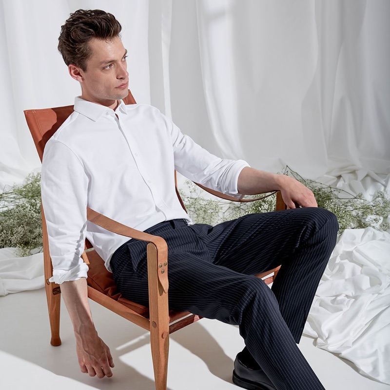 A smart vision, Nick Rea wears pinstripe trousers with a crisp white shirt.