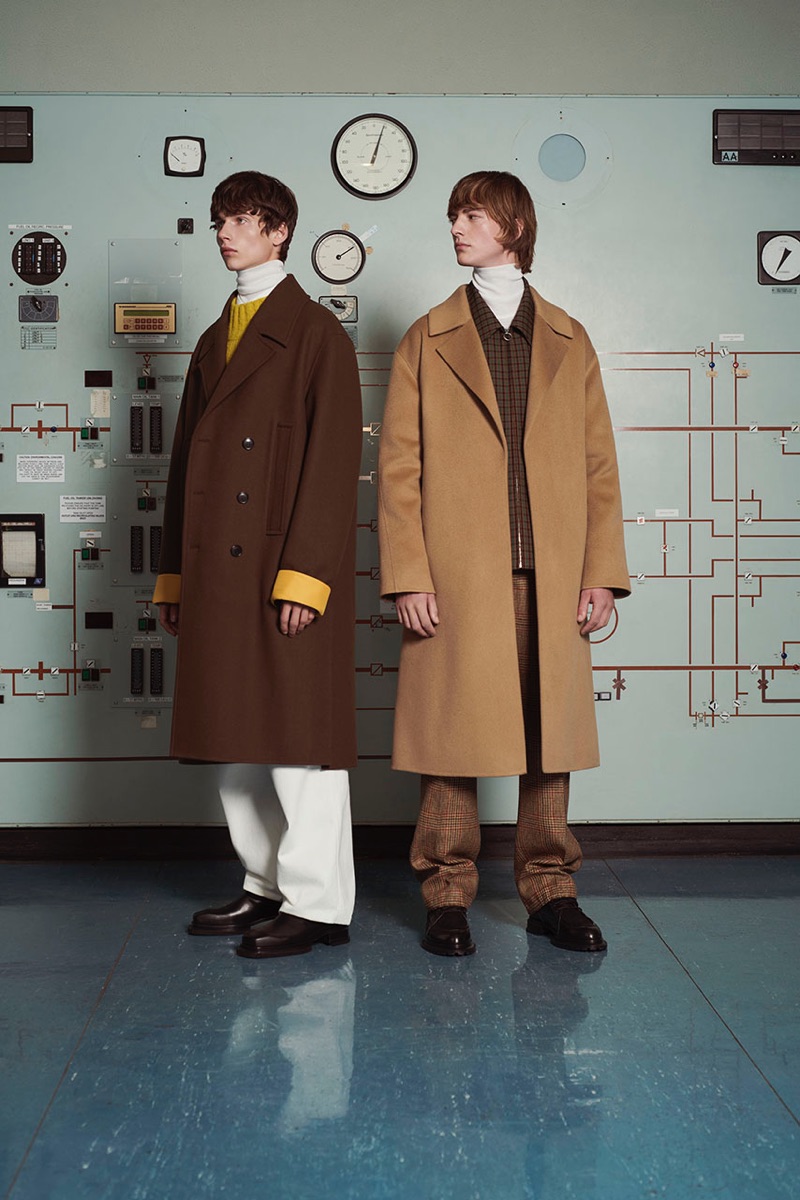 Donning oversized coats, Augusts Traumanis and Bartolomé Chapel wear looks from Solid Homme's fall-winter 2019 collection.