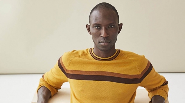 Armando Cabral sports a mustard yellow fine Italian merino wool stripe sweater $198 from Todd Snyder.