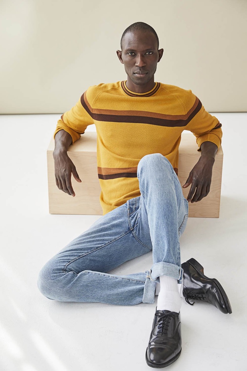 Armando Cabral sports a mustard yellow fine Italian merino wool stripe sweater $198 from Todd Snyder.