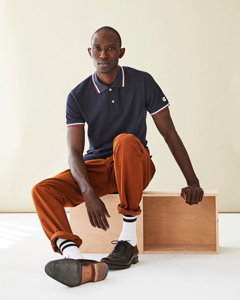 Taking to the studio, Armando Cabral models a navy tipped polo $98 by Todd Snyder + Champion.