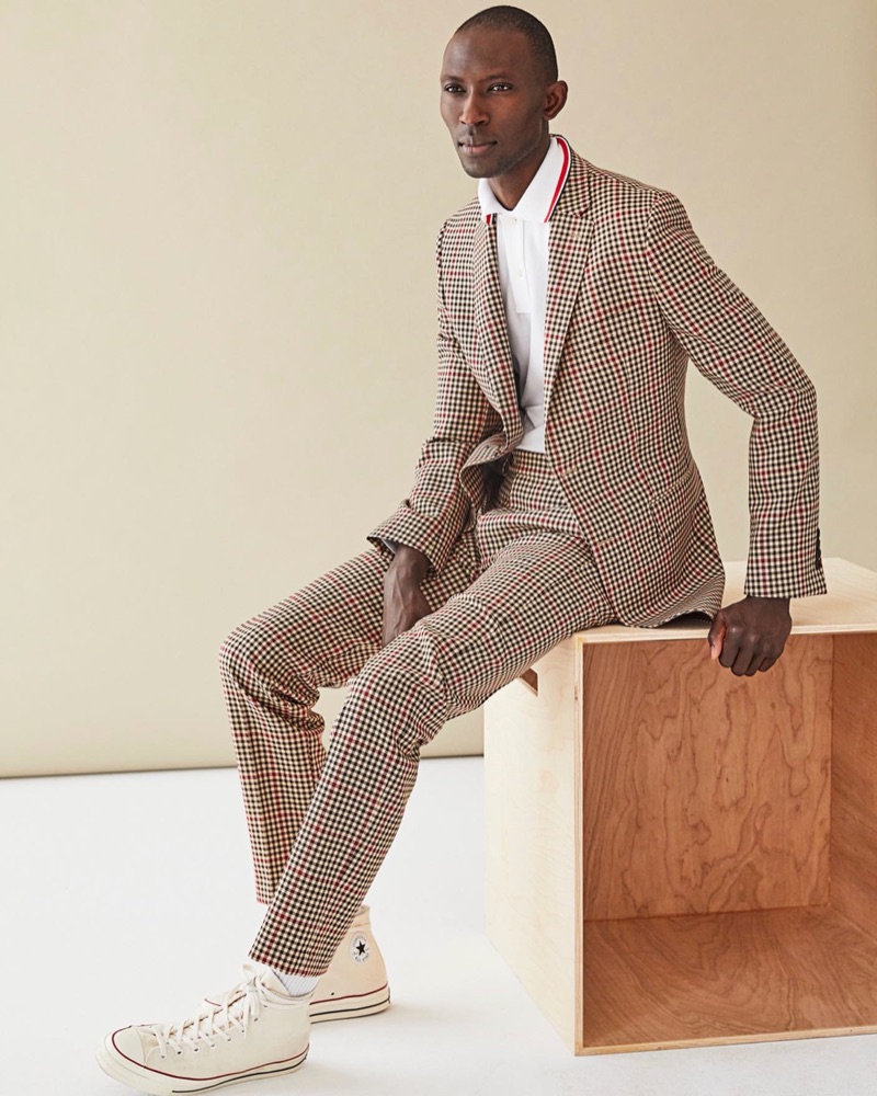 A sharp vision, Armando Cabral wears Todd Snyder's red and brown check Sutton suit.