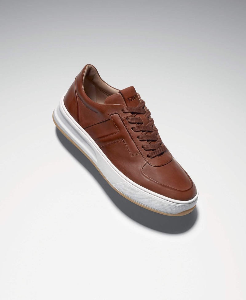 Tod's elevates sneakers with its brown leather style.