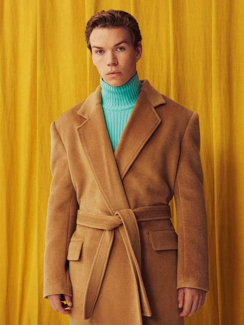 Actor Will Poulter sports a BALENCIAGA coat £2,550 and polo neck £975.