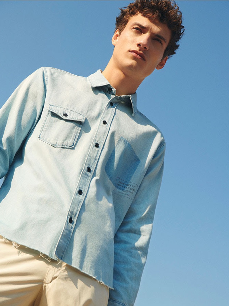 Donning denim, Serge Rigvava wears a look for YOOX.