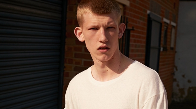 Embracing essential style, Connor Newall wears a pocket tee and jeans by American Vintage.