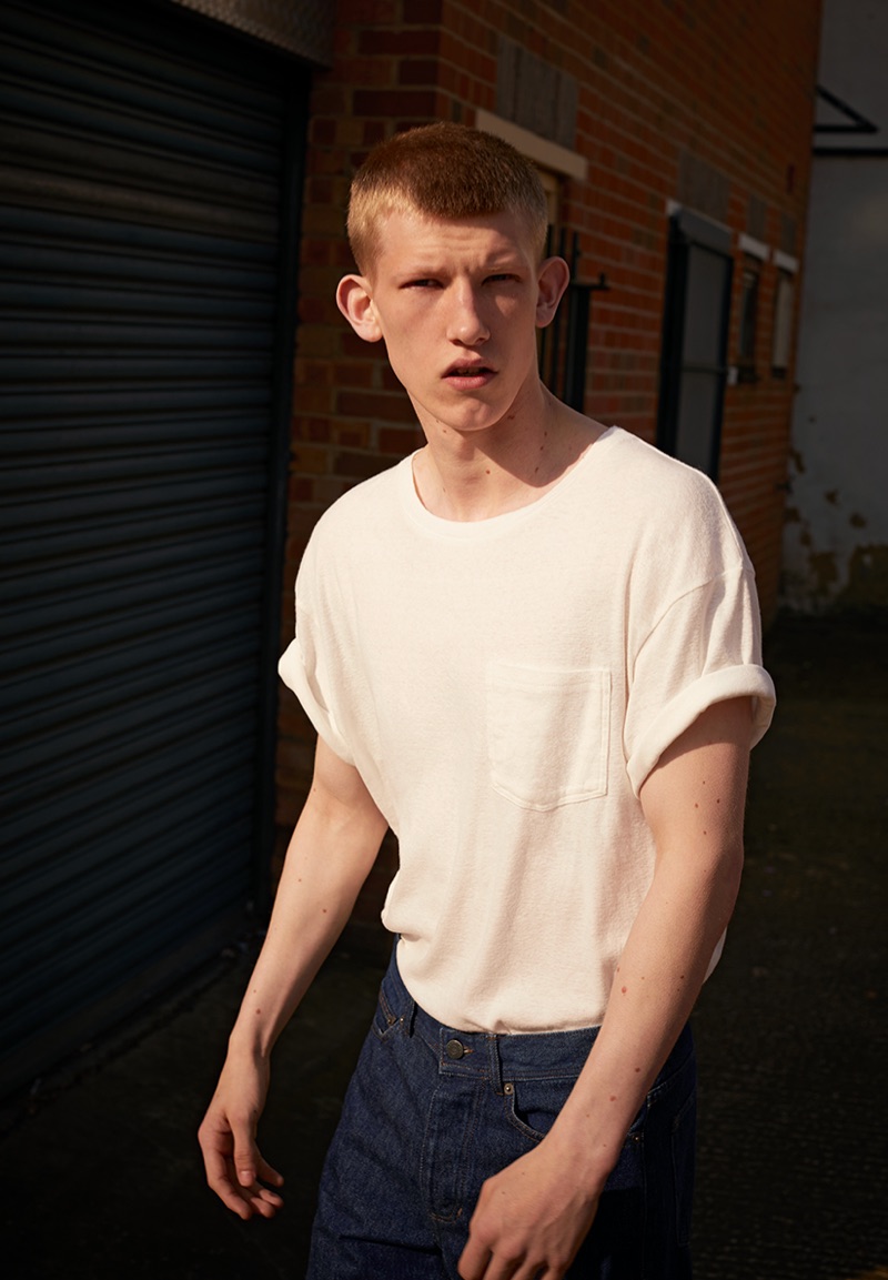 Embracing essential style, Connor Newall wears a pocket tee and jeans by American Vintage.