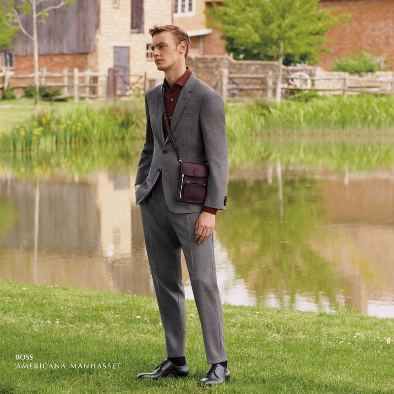 Donning a sleek grey suit, Roberto Sipos wears BOSS.