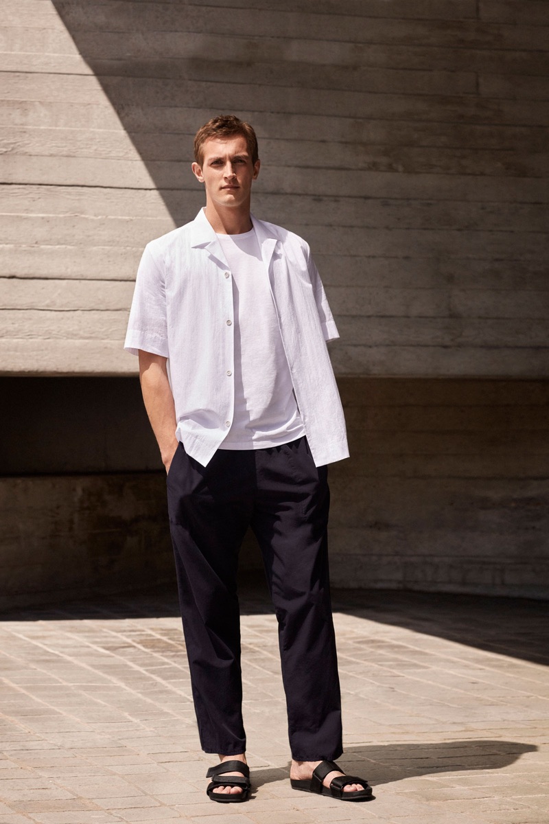 Rutger Schoone dons a white and black outfit from COS.