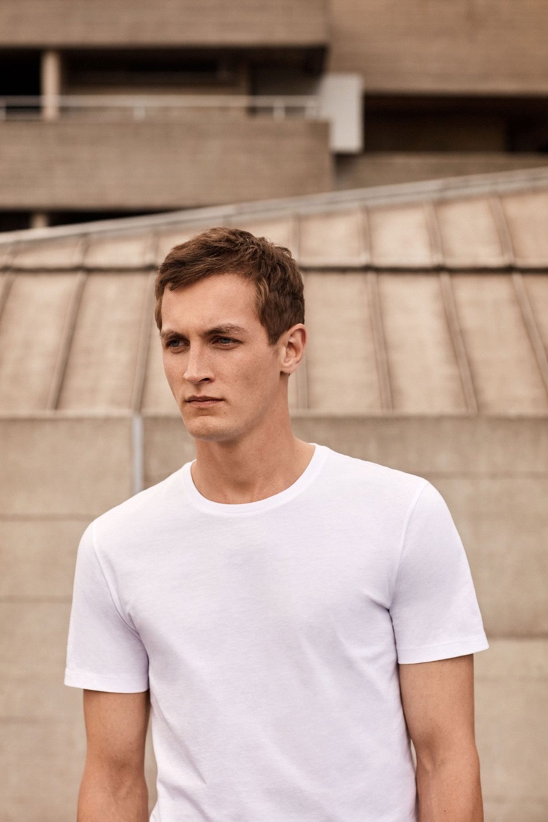 Model Rutger Schoone goes relaxed and easy in a COS t-shirt.