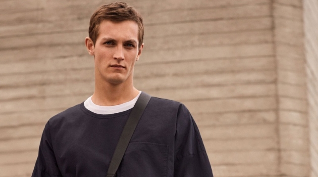 Rutger Schoone Dons Minimal Partywear Looks for COS Committing to a black and white look, Rutger Schoone rocks an oversized tee from COS.