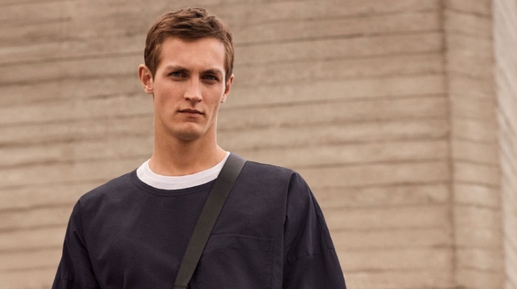 Committing to a black and white look, Rutger Schoone rocks an oversized tee from COS.
