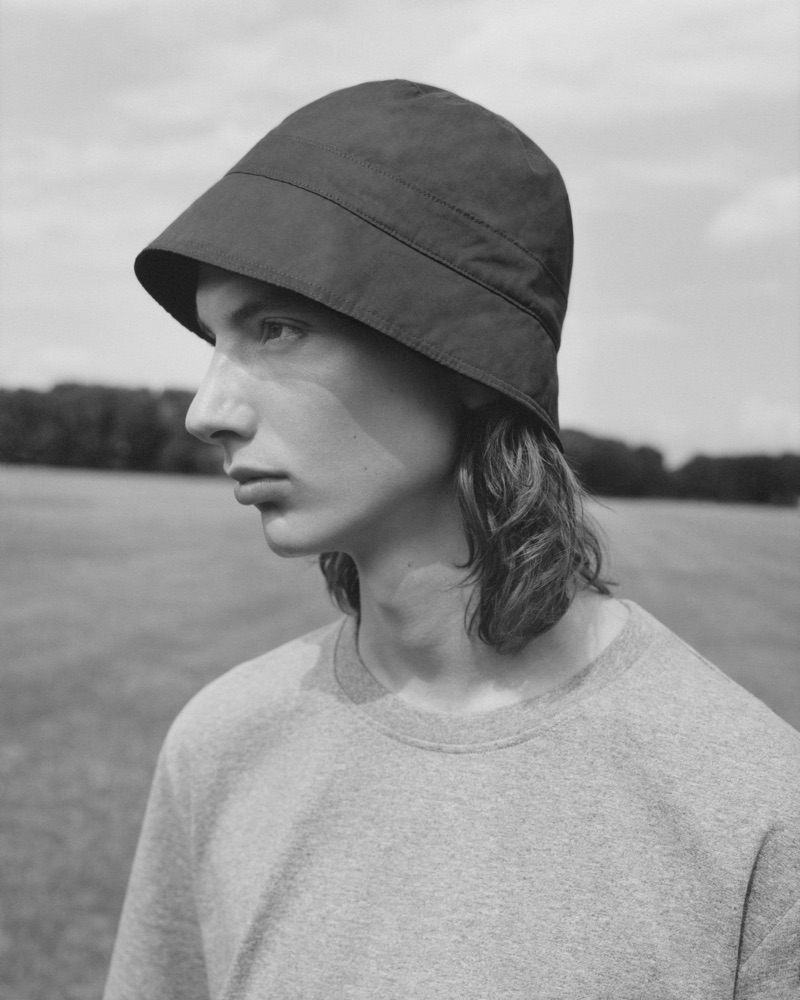 Casper Plantinga wears a bucket hat and top from COS.