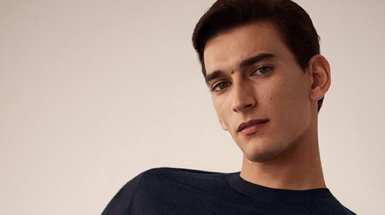 Thibaud Charon dons a fine merino sweater from COS.