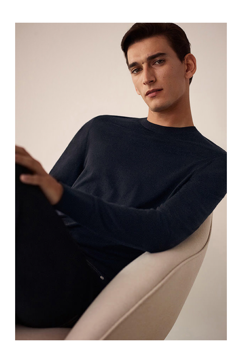 Thibaud Charon dons a fine merino sweater from COS.
