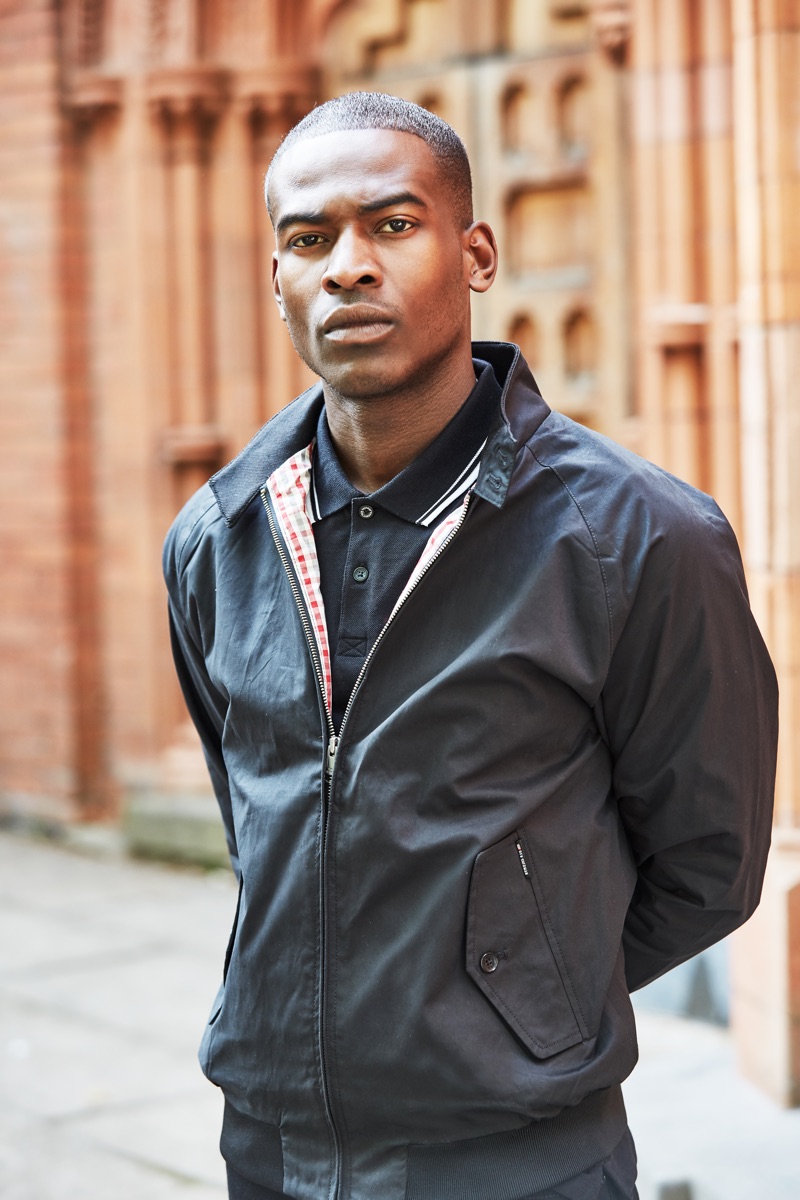 Chris Reid wears a Harrington jacket and polo by Ben Sherman.