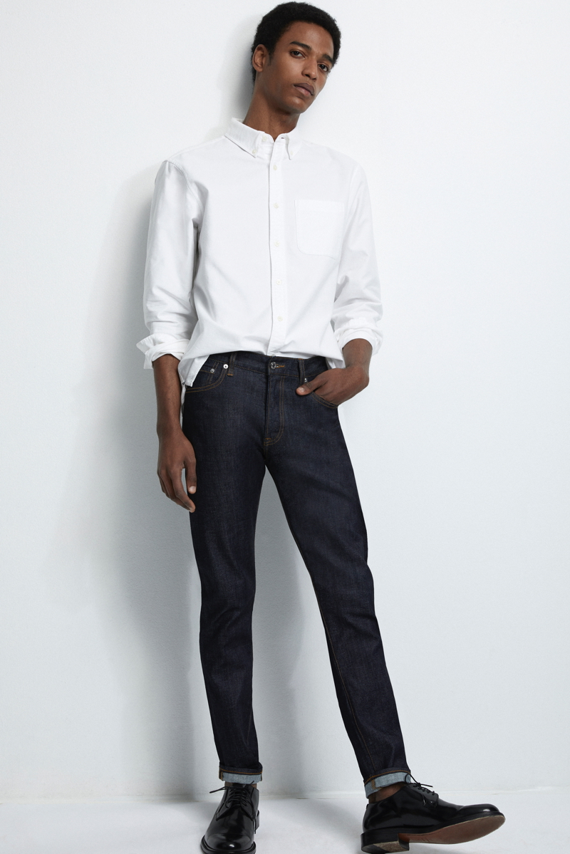 Darron Clarke sports Club Monaco's slim straight denim jeans in black.