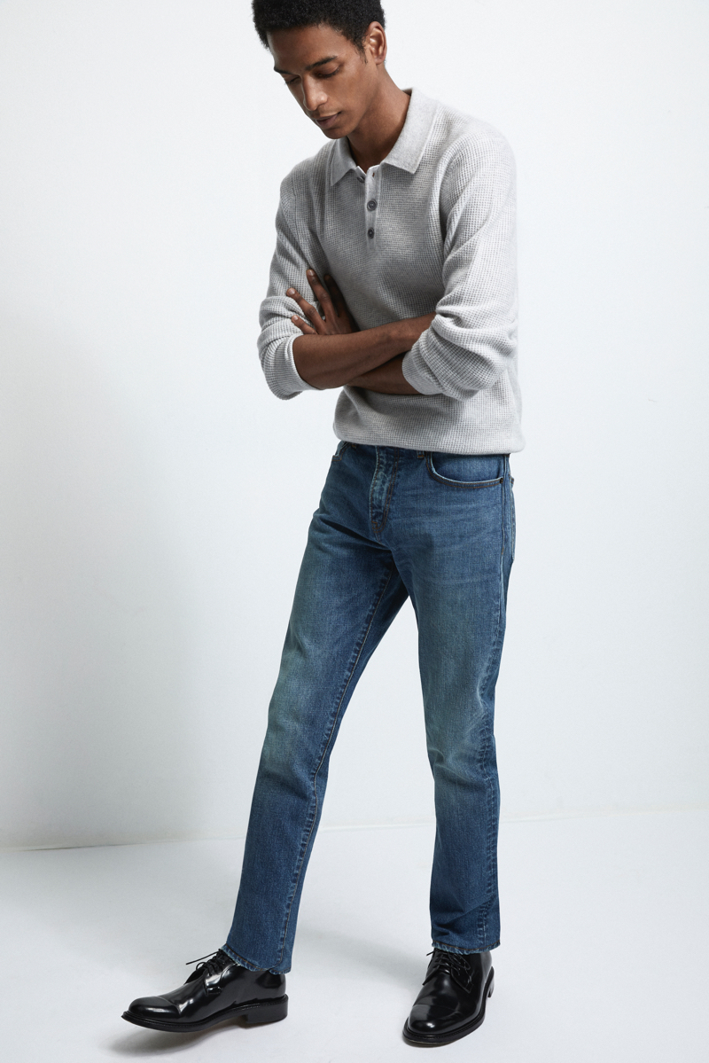 Model Darron Clarke wears Club Monaco's super slim denim jeans in indigo blue.