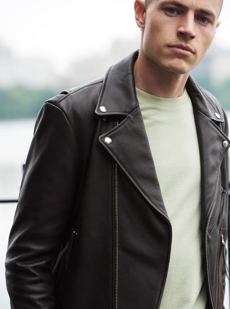 Rocking a leather biker jacket $650, Jonas Kloch dons easy fall fashions from Club Monaco.