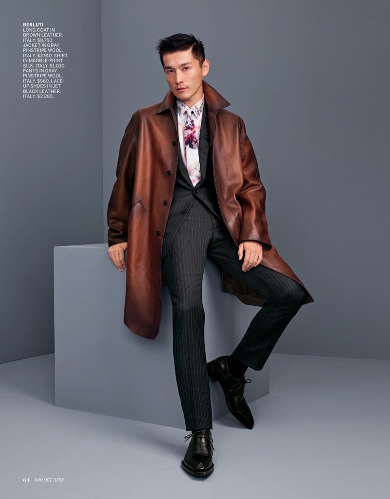 Daisuke Ueda dons a sleek brown leather coat with a grey pinstripe suit by Berluti.