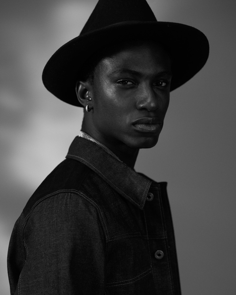 Fiifi wears jacket G-Star RAW, shirt Versace, and hat Crystal Birch.