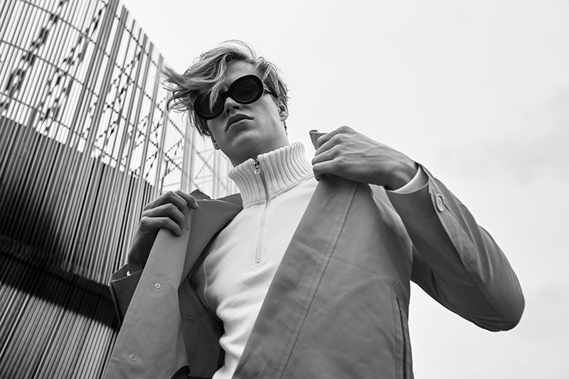 Arvid wears jacket Brixtol Textures, sweater Boomerang, and sunglasses Ace & Tate.