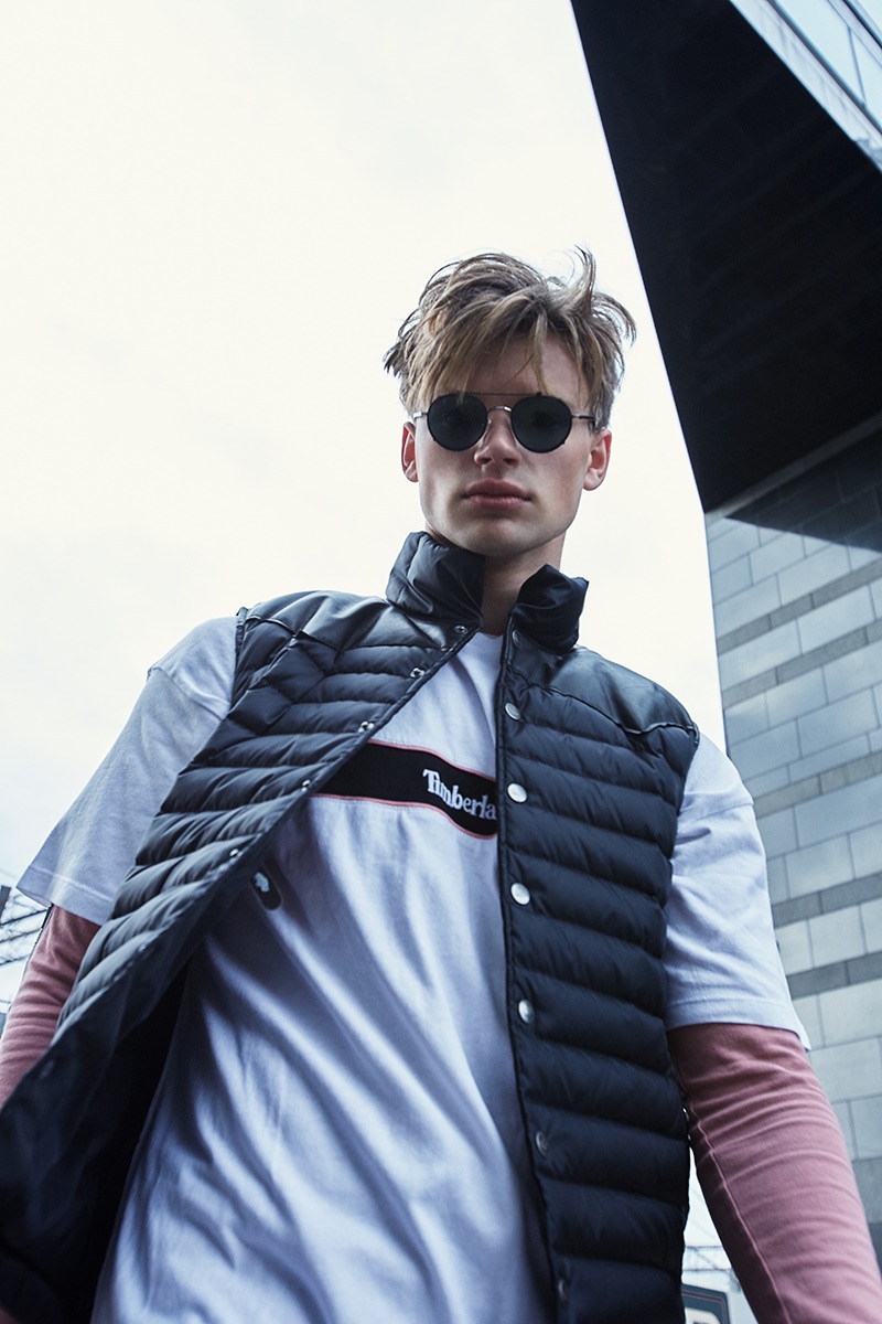 Ludvig wears vest Jackson Hole, pants Dockers, sunglasses Ace & Tate, t-shirt and sweater Timberland.