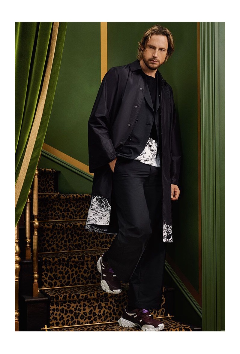 Embracing sporty proportions, Gabriel Aubry models fashions from Valentino.