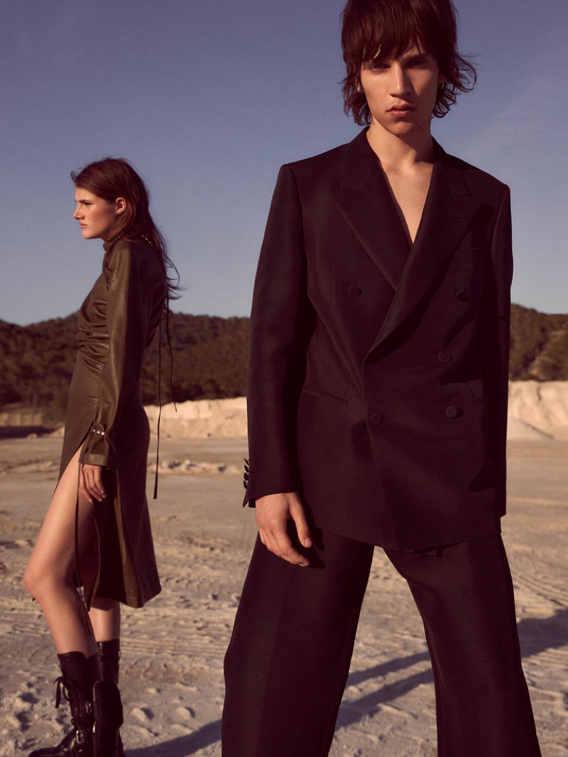 Lucia wears ACNE STUDIOS dress from a selection; PRADA boots £1,220; Eliseu wears DUNHILL jacket £1,995 and trousers £595