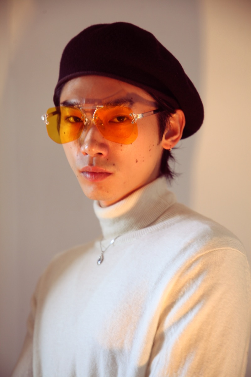 Hidetatsu wears beret SCHA, sunglasses PRTTYBOI, turtleneck Calvin Klein, and necklace XU Harajuku.