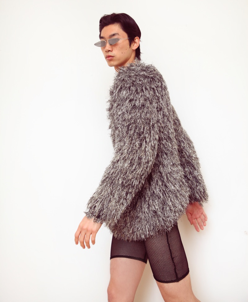 Hidetatsu wears sunglasses Gentle Monster, sweater ASOS Design, and shorts Revolve.