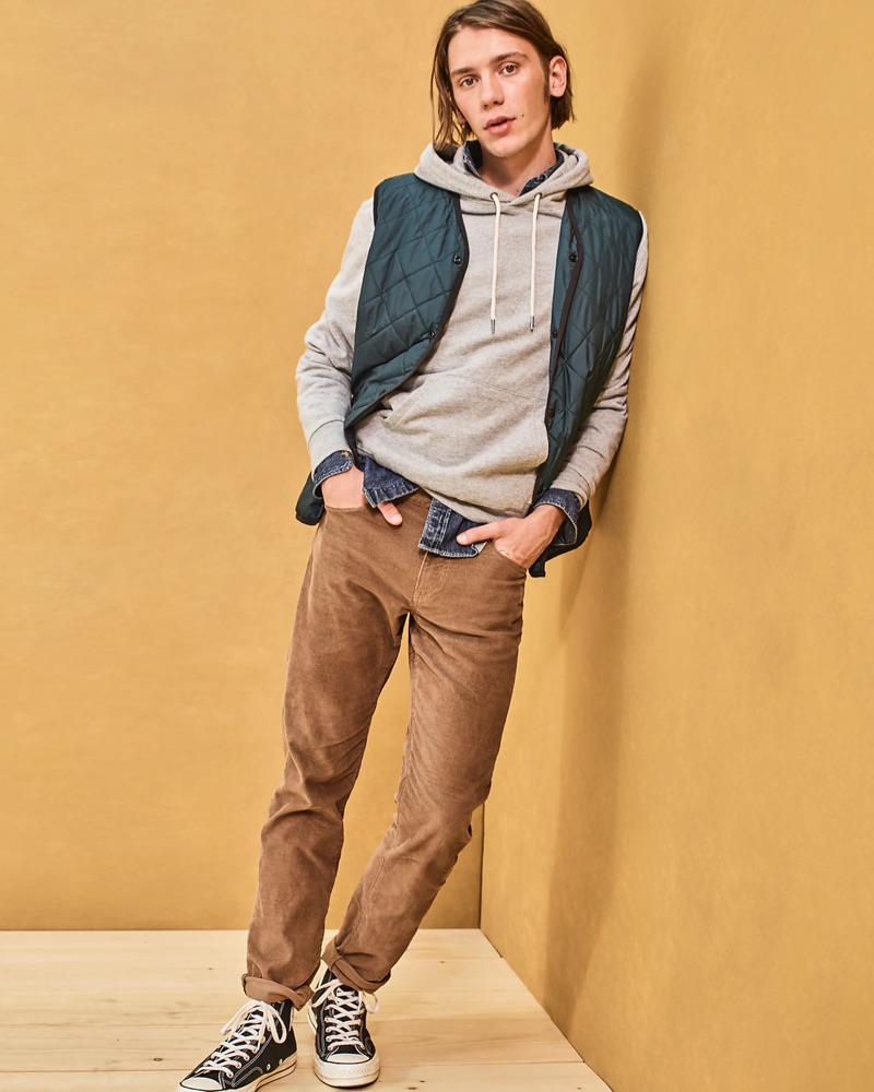 Front and center, Luca Bertea sports a J.Crew denim shirt $79.50, quilted vest $128, hoodie, 770 corduroy pants $79.50, and Converse Chuck Taylor All Star '70 high-top sneakers $85.