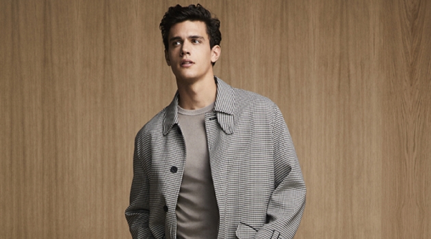 Nordic Reflection: Xavier Serrano, Federico Massaro + More for Liu Jo Uomo Xavier Serrano sports a chic checked coat with pleated trousers and a sweater from Liu Jo Uomo.
