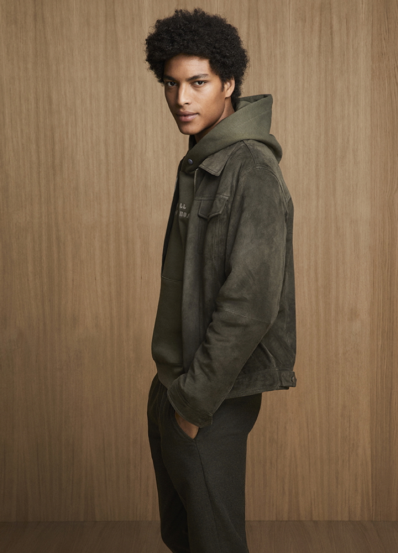 Jhonata Meneghini models a suede jacket and hoodie from Liu Jo Uomo.